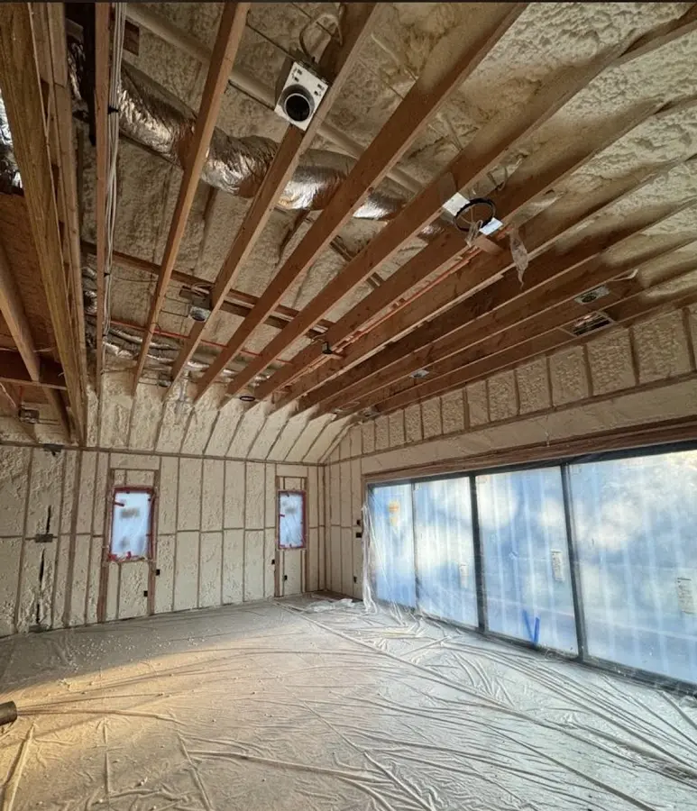 Interior walls and ceiling insulated with spray foam during new construction in Birmingham